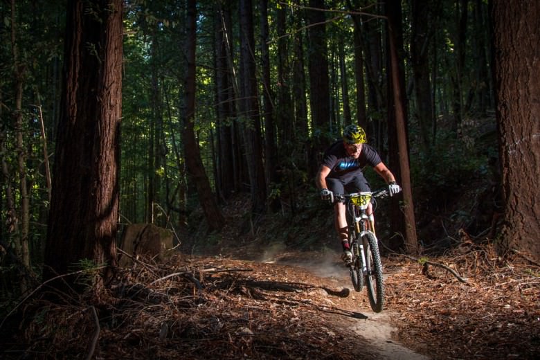 Craig Harvey builds custom homes for a living and races bikes out of pure joy. Harvey showing off his game face beneath the redwoods of Soquel Demonstration Forest. Photo: Called to Creation.