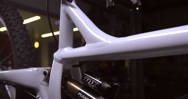 With a seat-tube that short, you will need a dropper seat post.