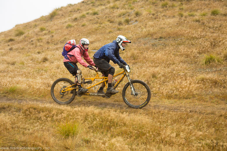 Love is… riding tandem in bad weather.