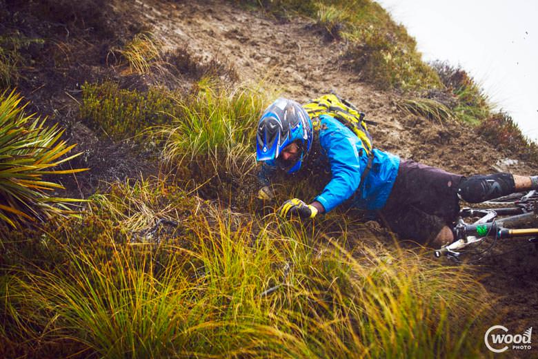 Another rider gets a taste for Queenstown mud.