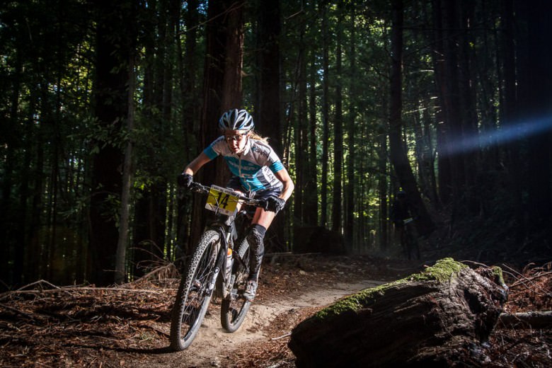Jamie Busch catches a brief pocket of sunlight in the deep dark redwoods during the 2013 race. Photo: Scott McClain, Called To Creation