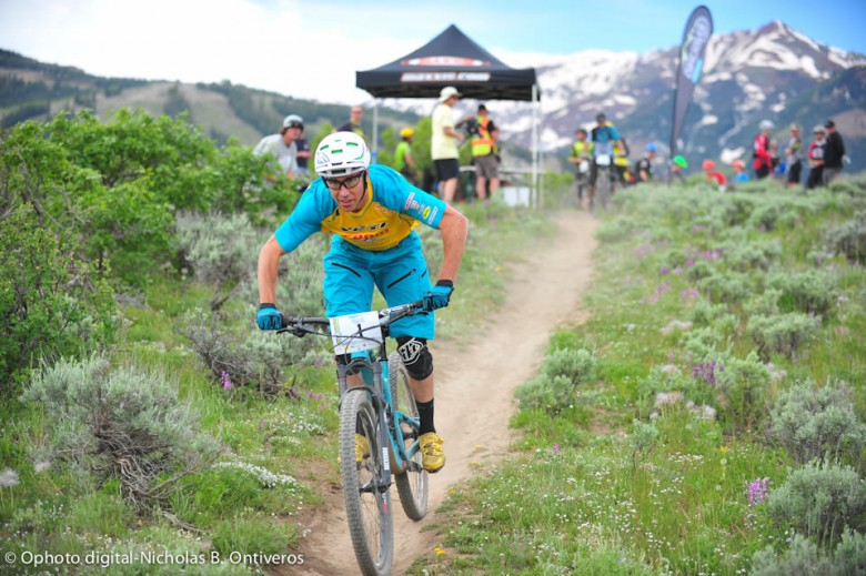 Nate Hills, last year's overall champ, wearing plate #1 with Maroon Bells in the background. 