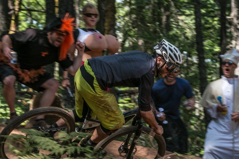 Racer Ryan Cleek concentrates on the line ahead, trying to keep a straight face while whizzing through the peanut gallery of hecklers. Photo: Dennis Yuroshek. 