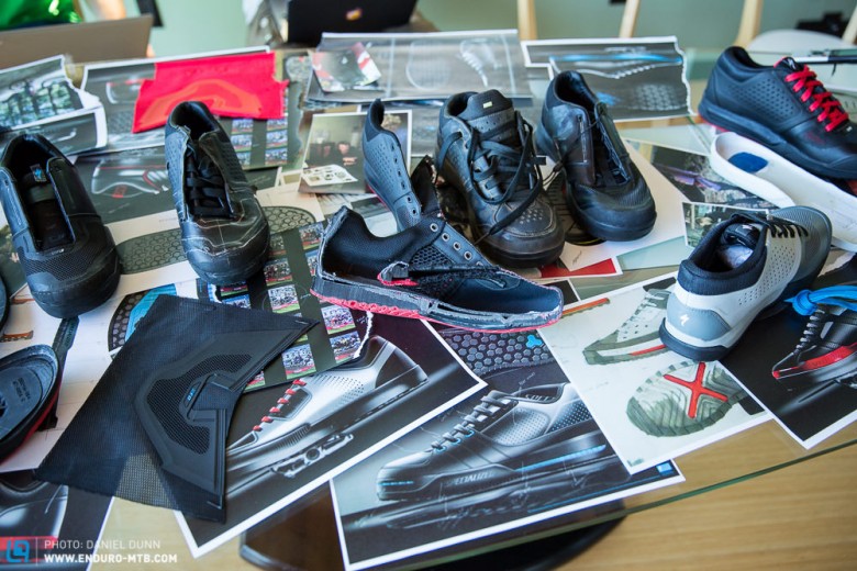 Many different itinerations of the shoe, including a slice down the middle. 