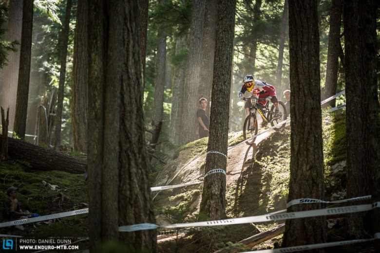 Trails built back in the 90's are being reinvigorated, upgraded, and brought back into the mix in Whistler. Instead of building new, course designers wanted to use what was already there. Rough and raw is what racers want, so that's what they got. Martin Maes atop a rock slide. 