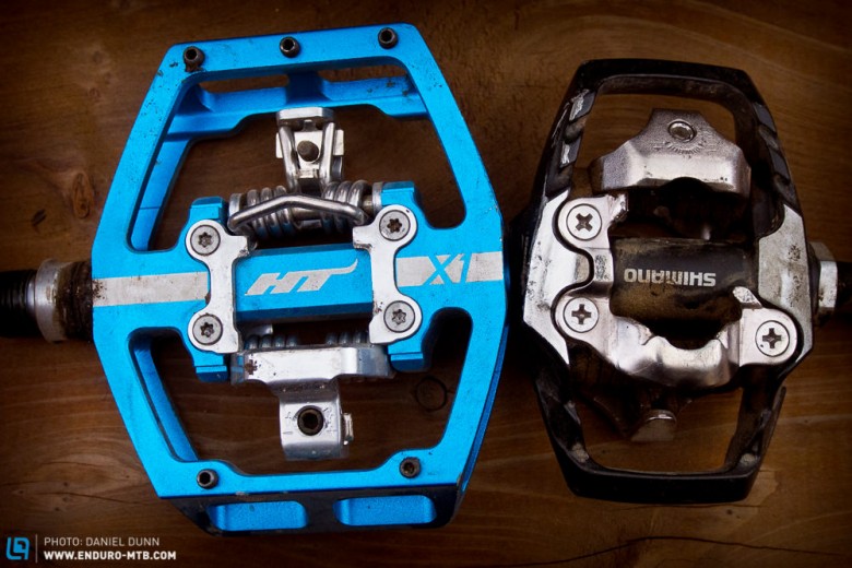 Comparing the platform sizes of the HT Components X1 and Shimano XT Trail pedals. 