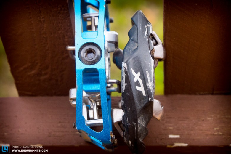 Comparing the overall thickness of the HT Components X1 and Shimano XT Trail pedals. 