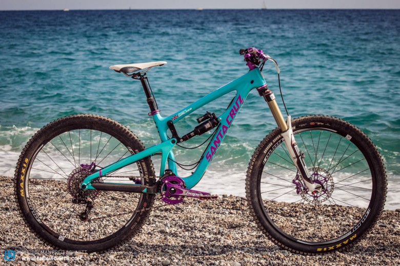 This Santa Cruz Nomad is dripping with purple Hope parts.