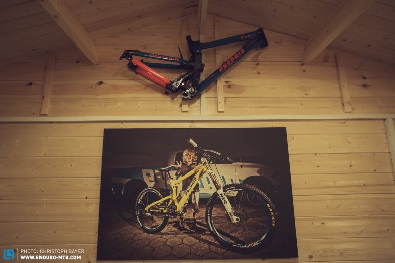 The first successful model, the downhill bike Rage hangs on the wall at Propain.