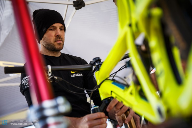 Dan Atherton works on his GT Sanction in the pits at Sea Otter