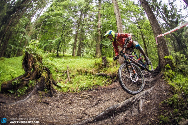 Cube Action Team rider bullies the bike through some huge roots