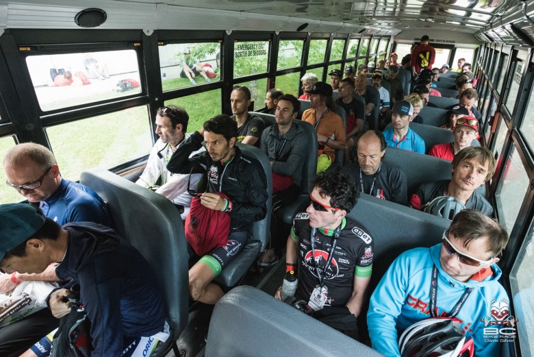 Racers ride the bus to Stage 3.