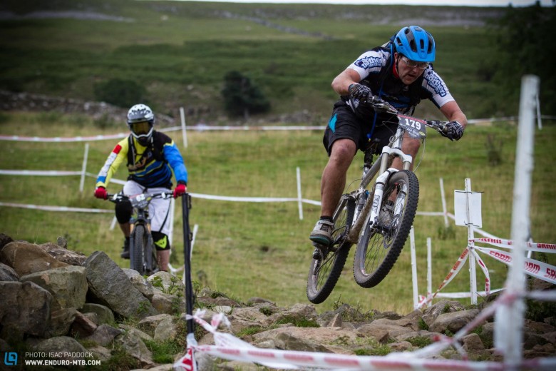 Lycra, no knee-pads, but he nailed the rock section, clearing the lot in style.