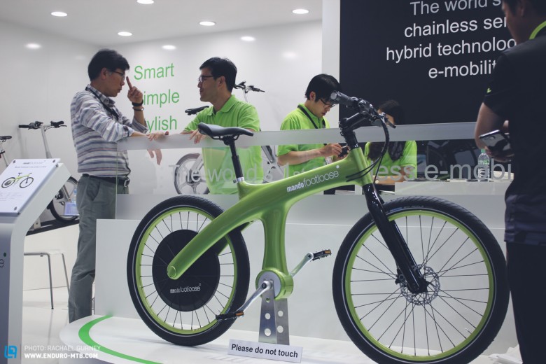 A chainless e-bike from company 'Mando', they refer to it as a car rather than a bike with its hybrid power system and electronic control unit regulating its functions. 