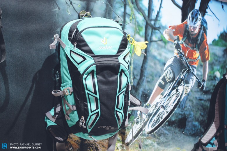 This women's specific pack with back protector from Deuter seems worth a look. At 20L capacity though its pretty darn big!