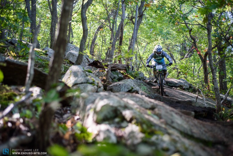 Mike Stem navigating through one of the cringe-worthy rock garden that defeated many riders.