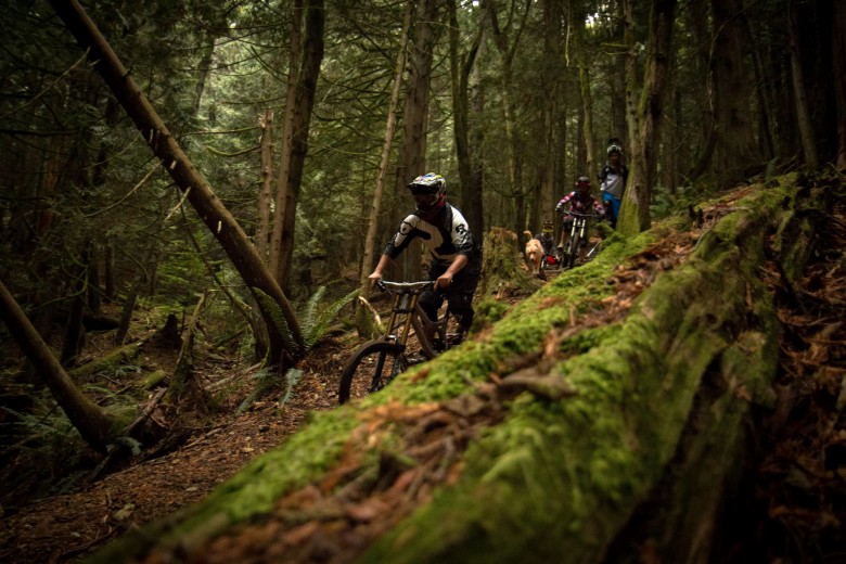 Loam Coffee rider Thomas Shaw leads a pack of riders on the North Shore in Vancouver, BC. 