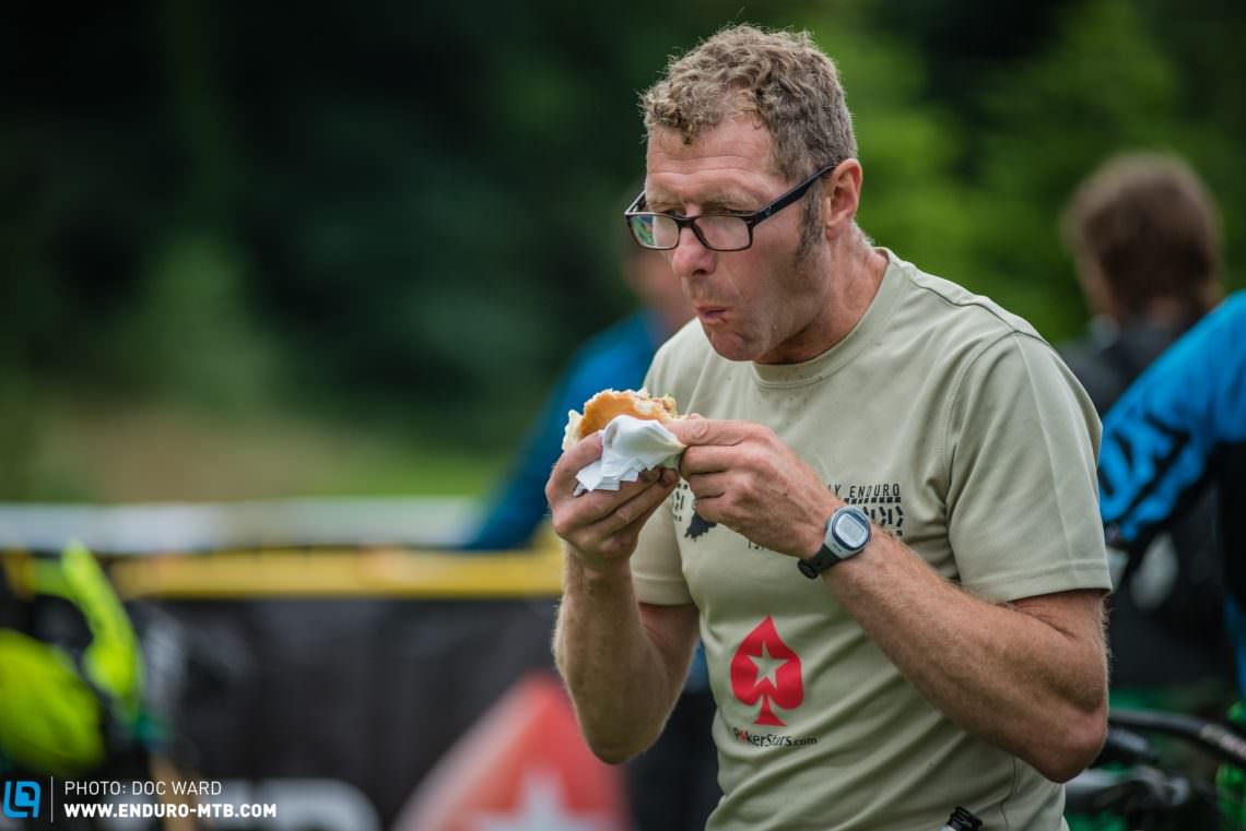 Top guy and race director Steve (Bear) Collins chows down on one of his free burgers.