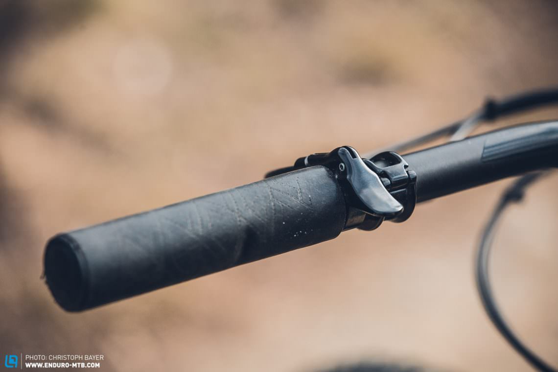 A practical and purposeful lever for the dropper seatpost, but the stuck-on grips didn’t do much for our test rider. 
