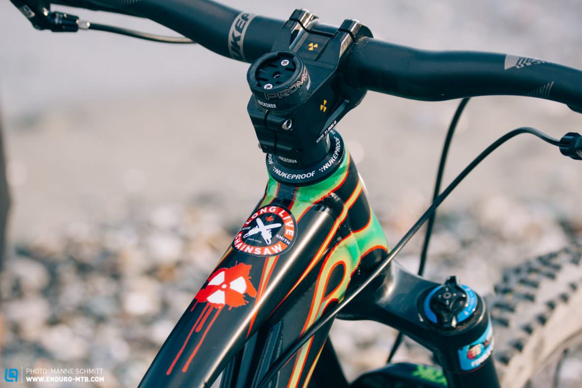 The cockpit is a Nukeproof Carbon Warhead bar and Warhead 50 mm stem, complete with Nukeproof Sam Hill signature grips (that must be a cool feeling).